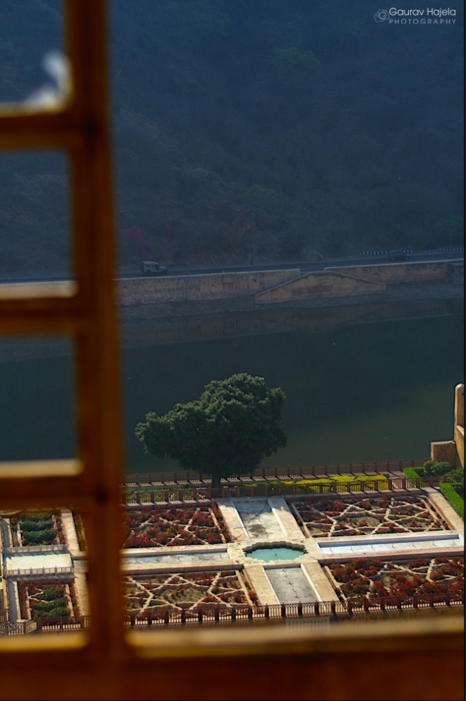 A bright view of Kesar Kyari Bagh from a window of Amer Fort
